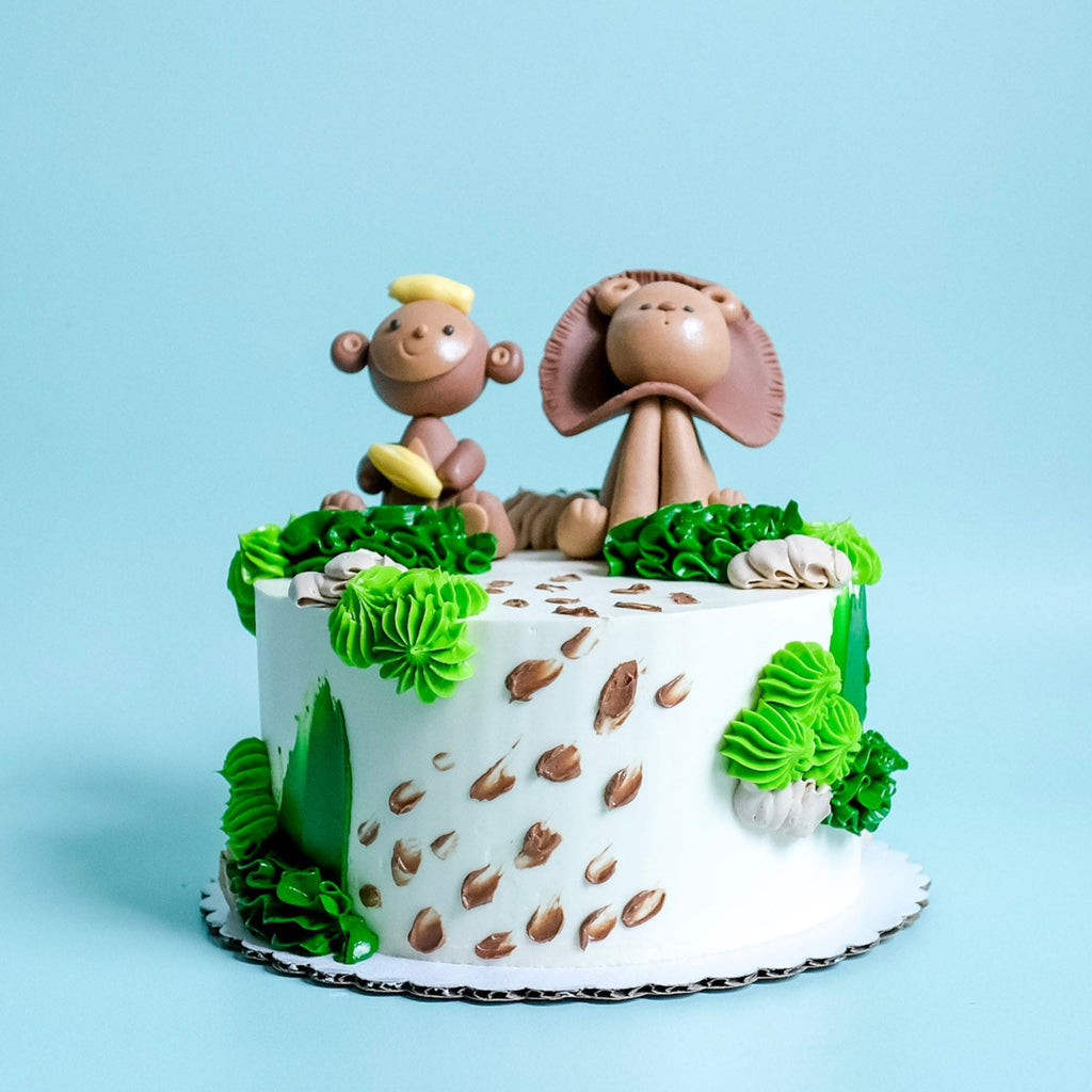 Safari Cake decorated with a Monkey and Lion. 