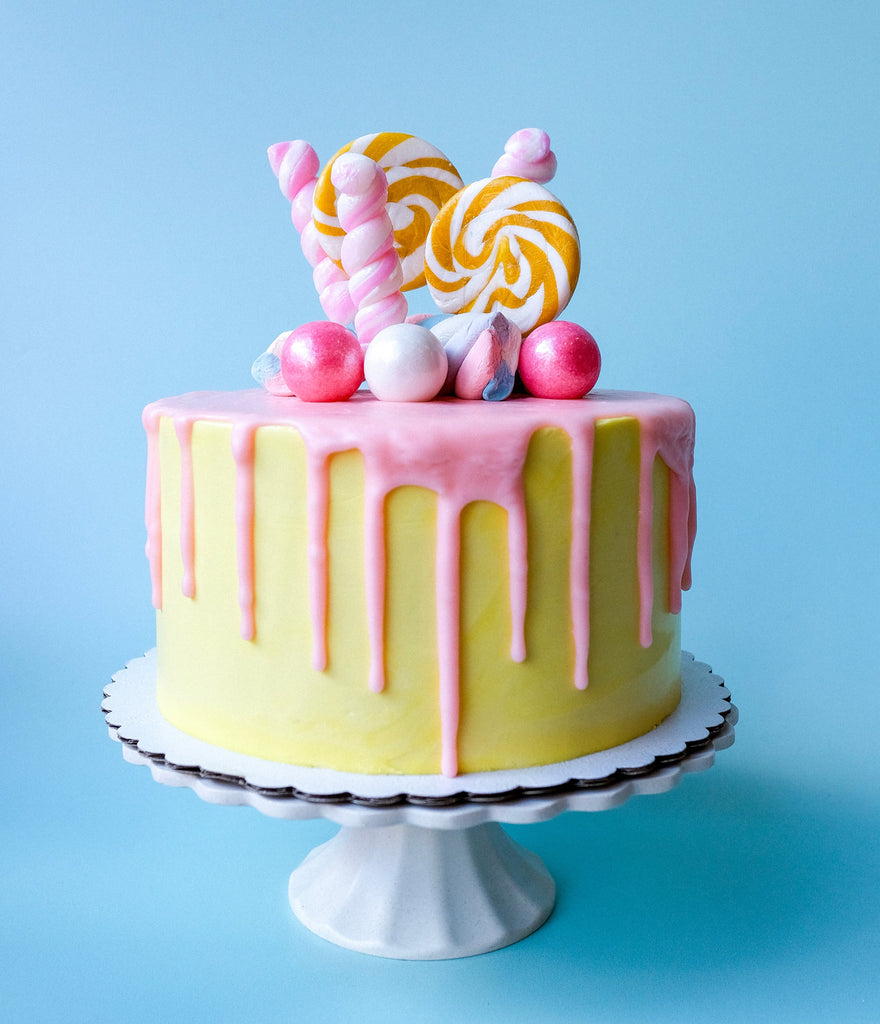 Yellow and Pink Candy Drip cake