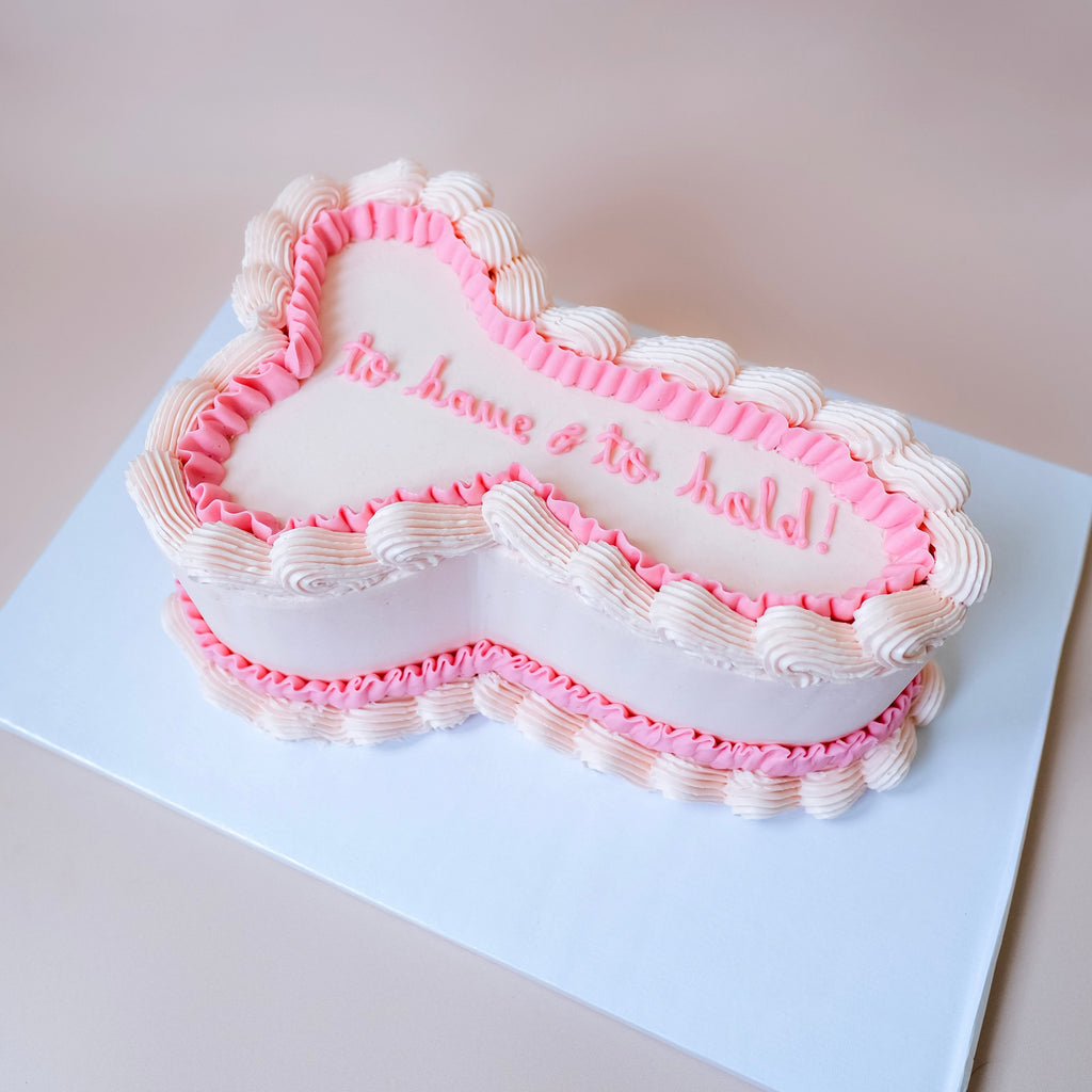 An ornate penis shaped bacholorette cake