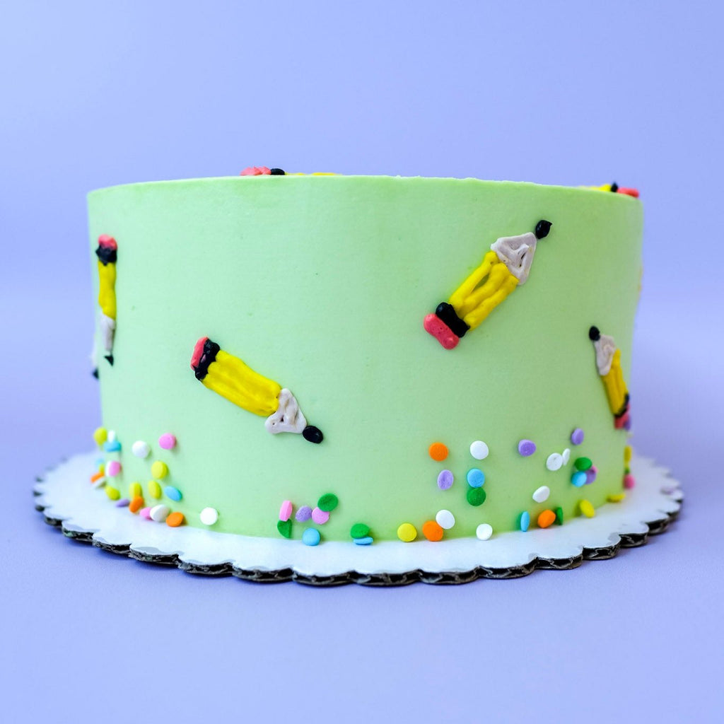Back to school cake decorated with mini pencils and sprinkles