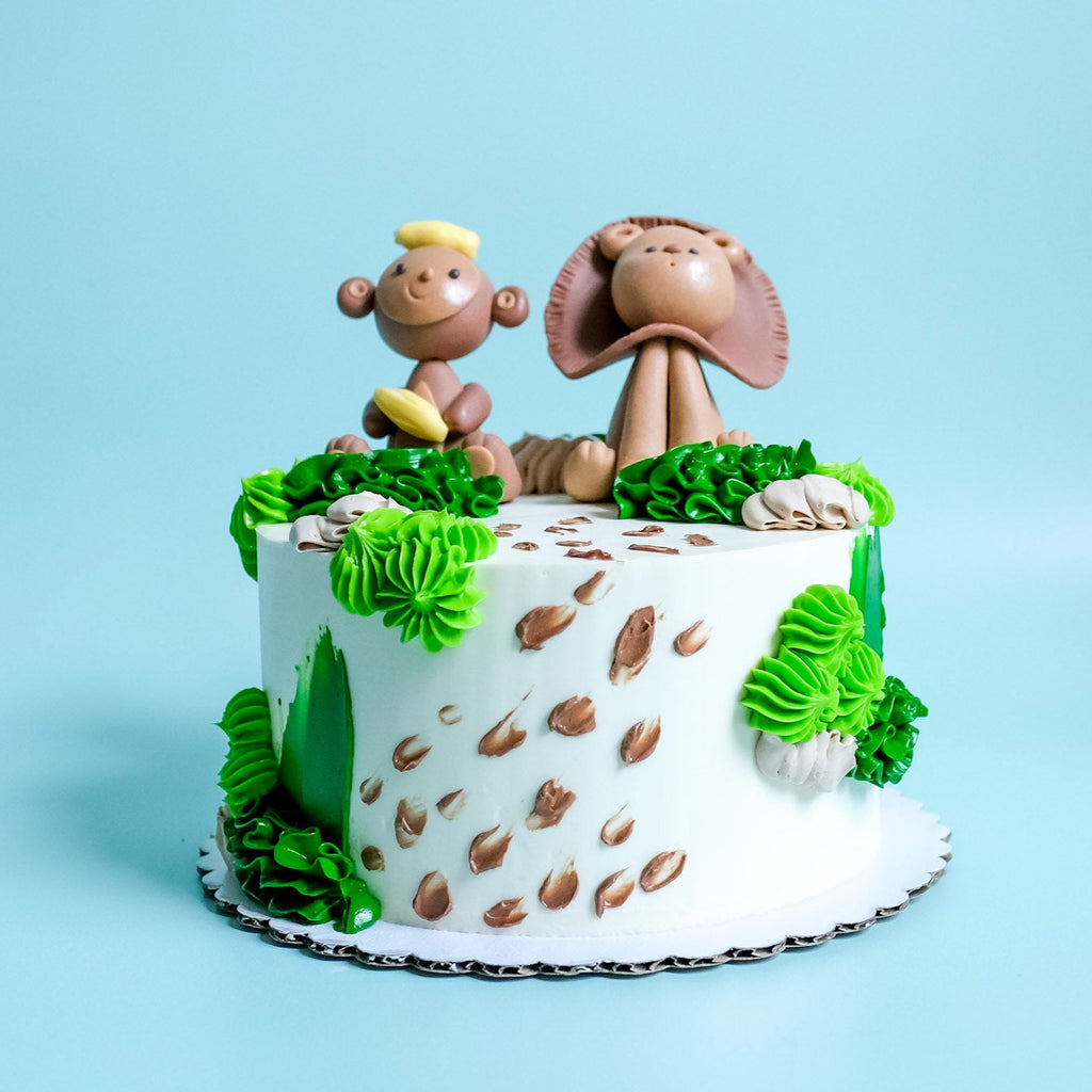 Safari Cake decorated with a Monkey and Lion. 