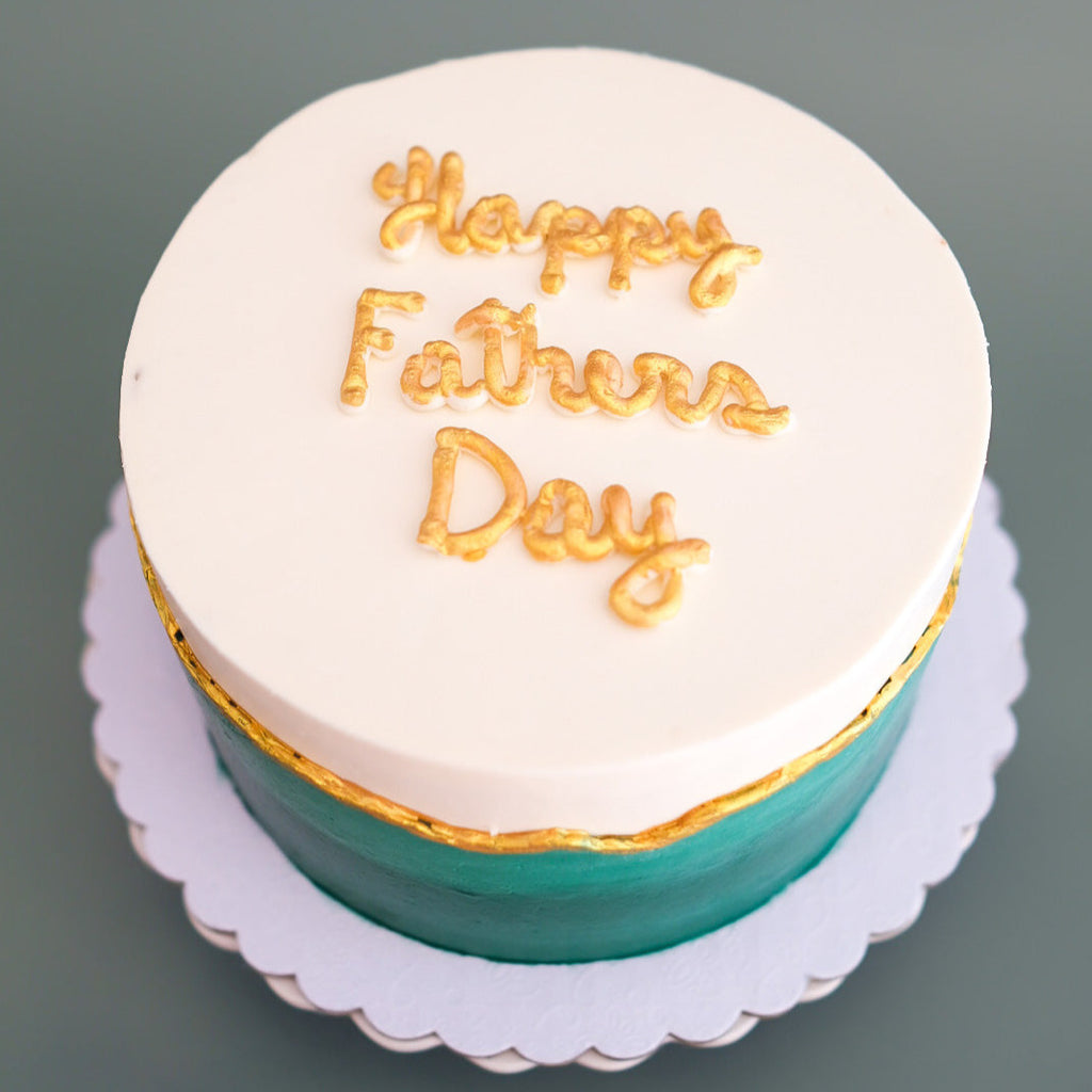 emerald green cake with gold details 