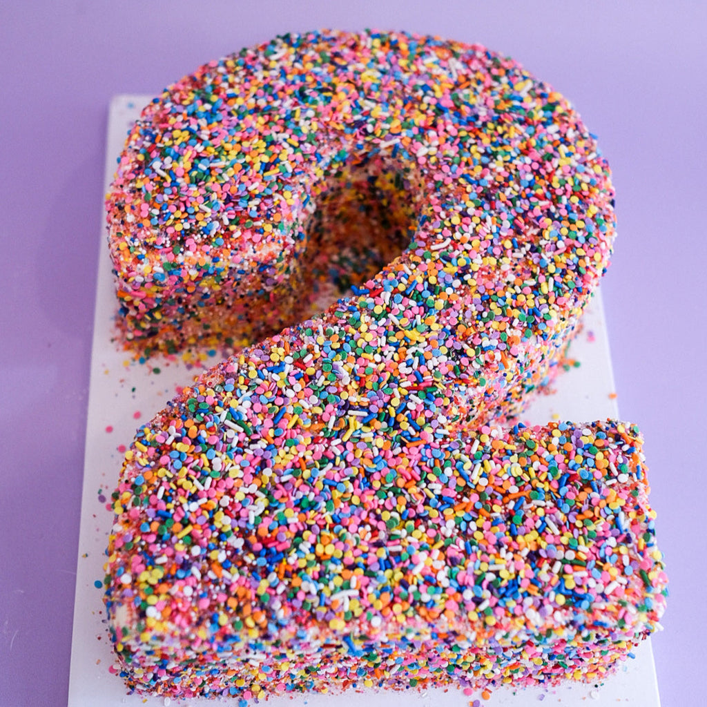 Rainbow sprinkle number cake 