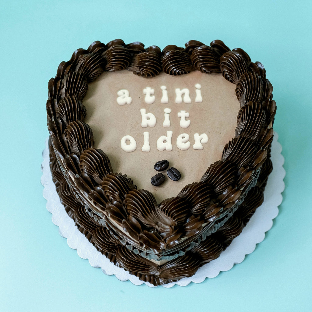 Brown Heart Shaped Ornate Tini Bit Older Espresso Cake. 