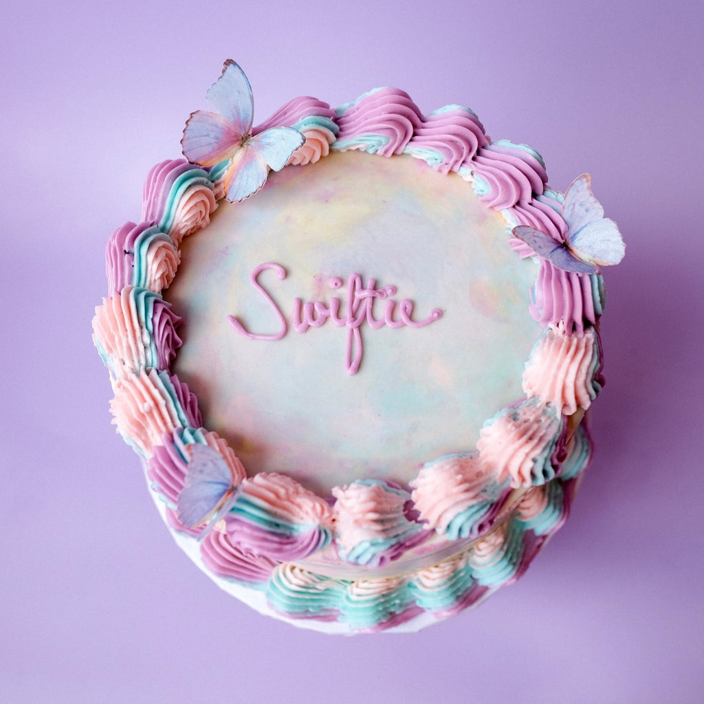 Ornate tie dye cake with butterflies 