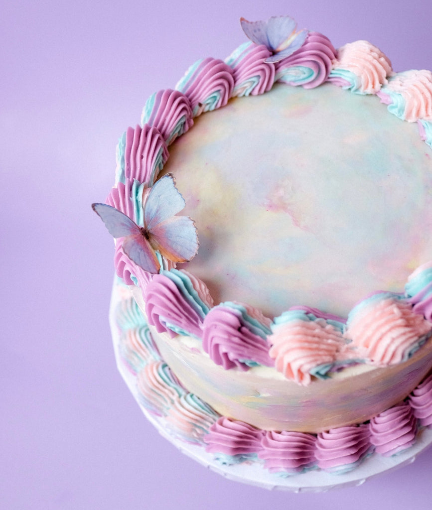 Ornate tie dye cake with butterflies 