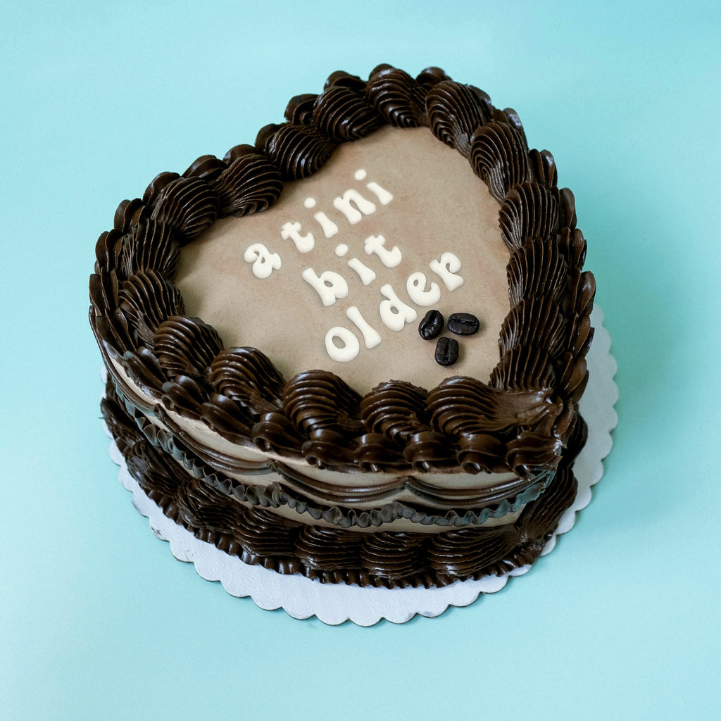Brown Heart Shaped Ornate Tini Bit Older Espresso Cake. 