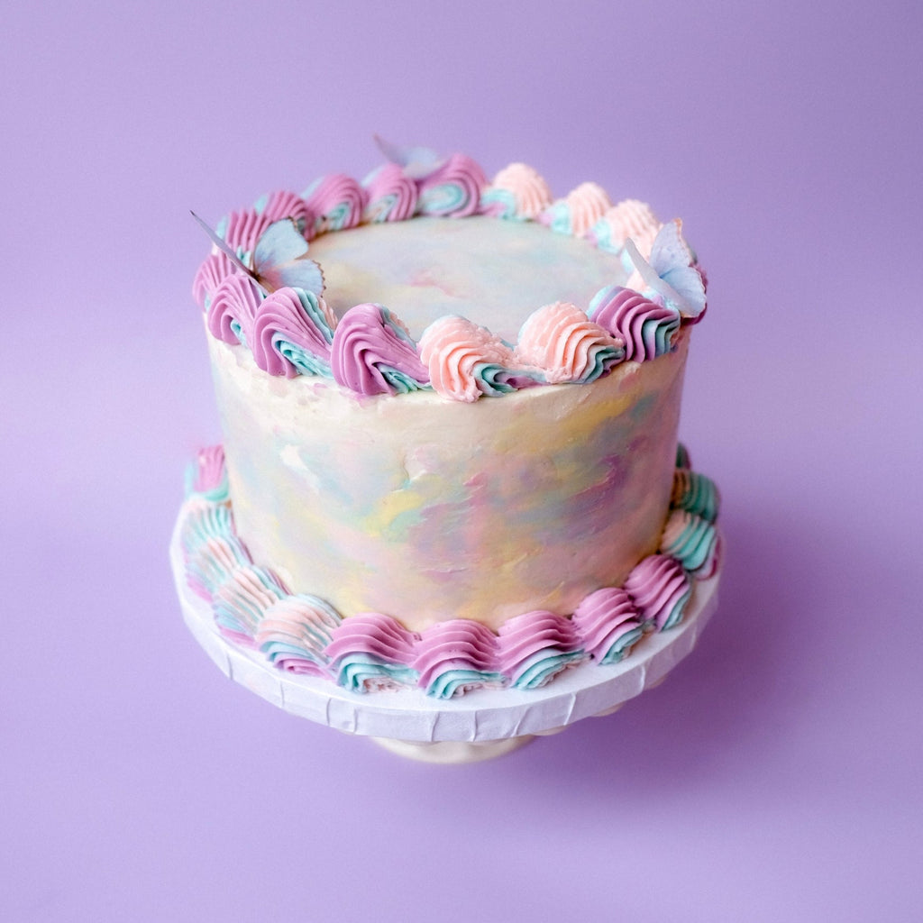 Ornate tie dye cake with butterflies 