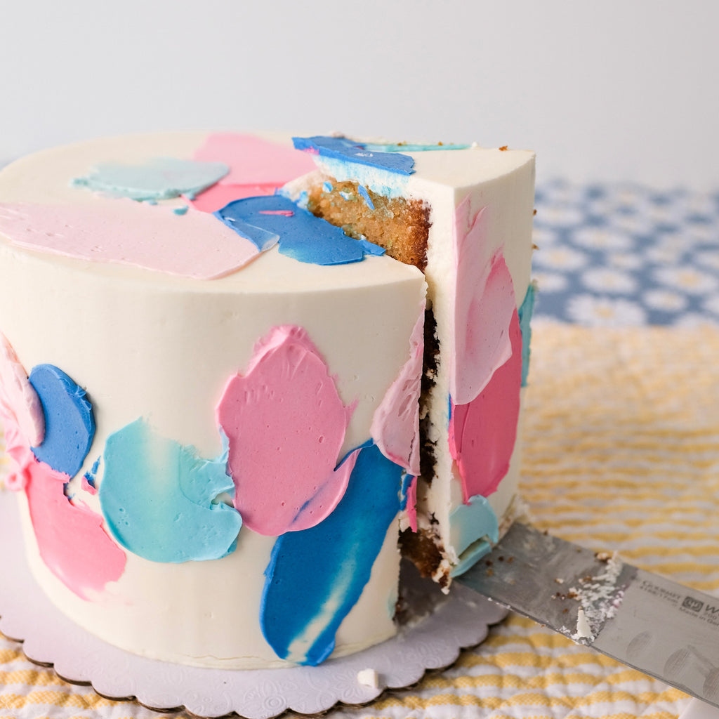 Blue and pink swatch gender reveal cake 