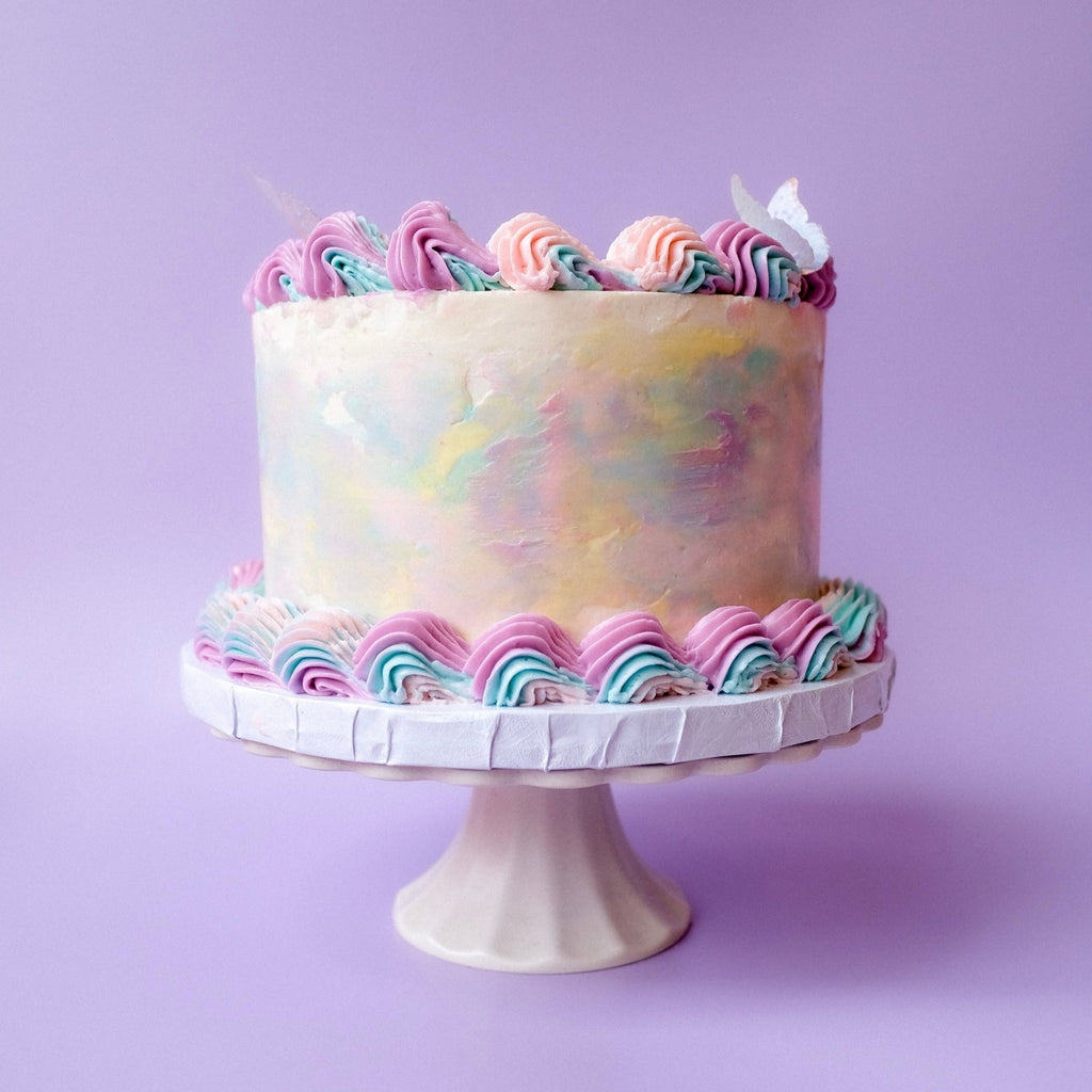 Ornate tie dye cake with butterflies 
