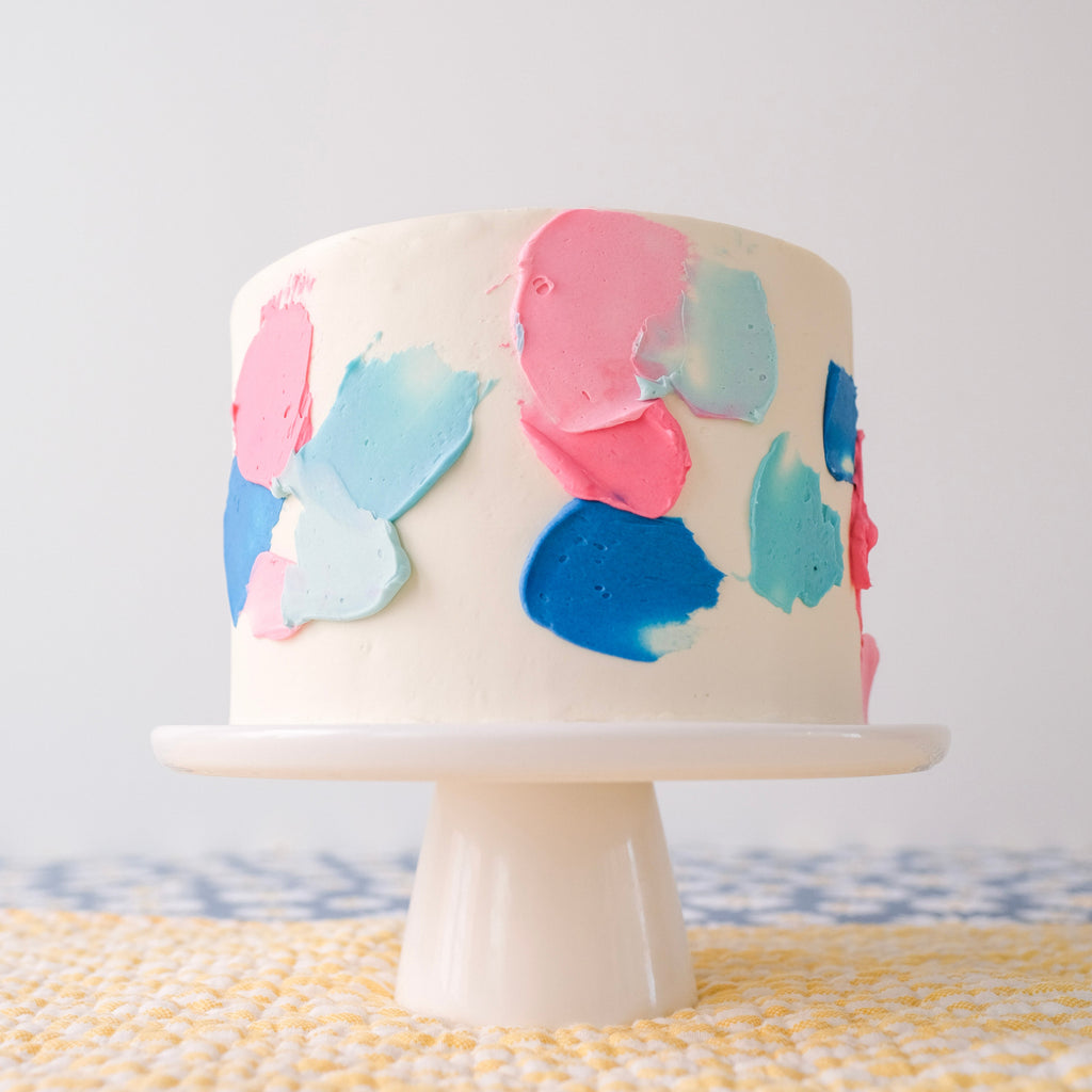 Blue and pink swatch gender reveal cake 