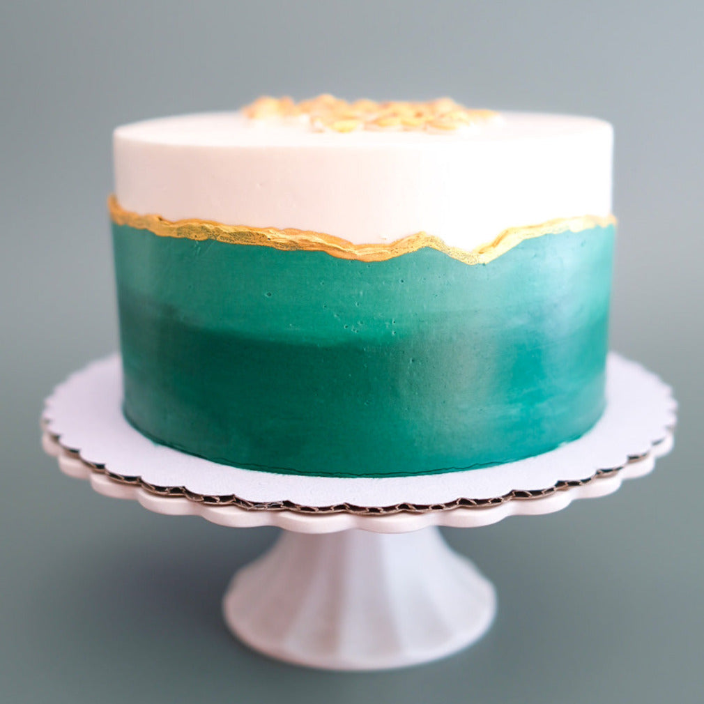 emerald green cake with gold details 