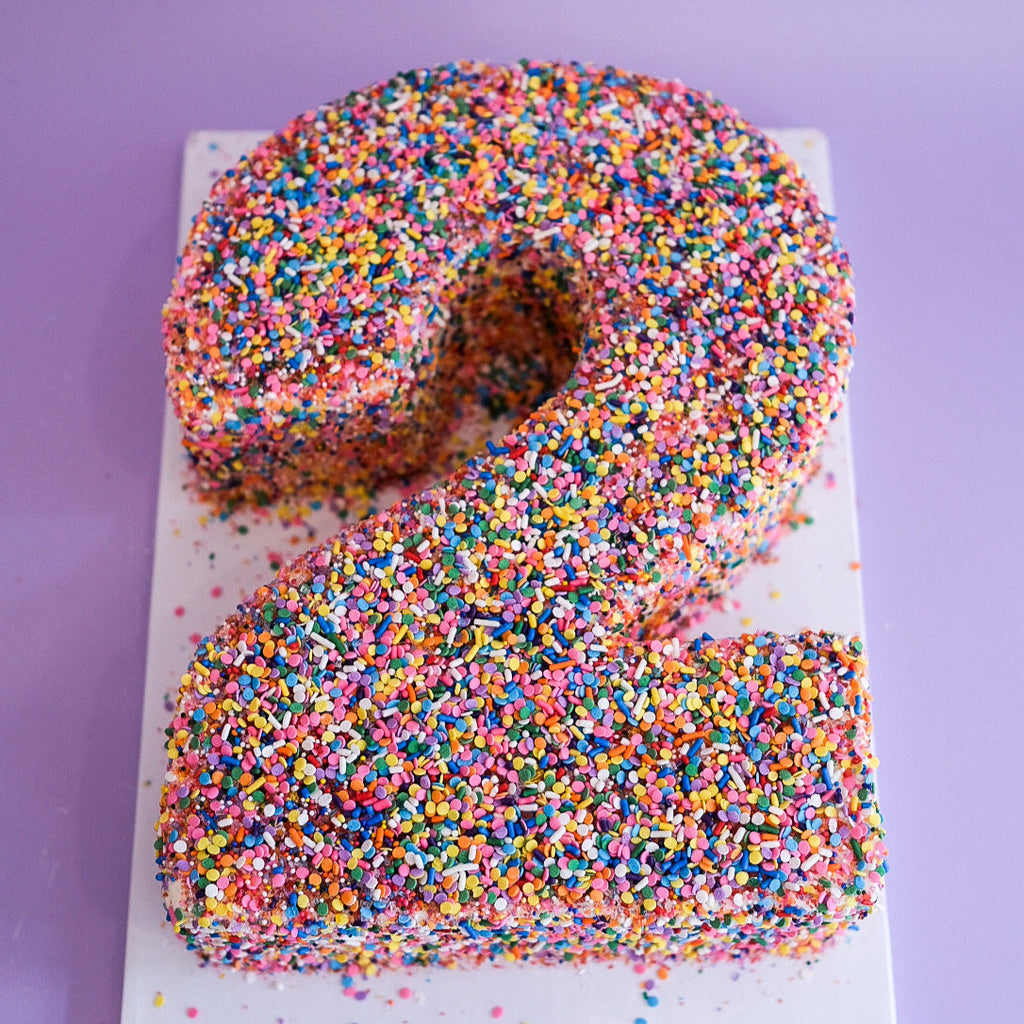 Rainbow sprinkle number cake 