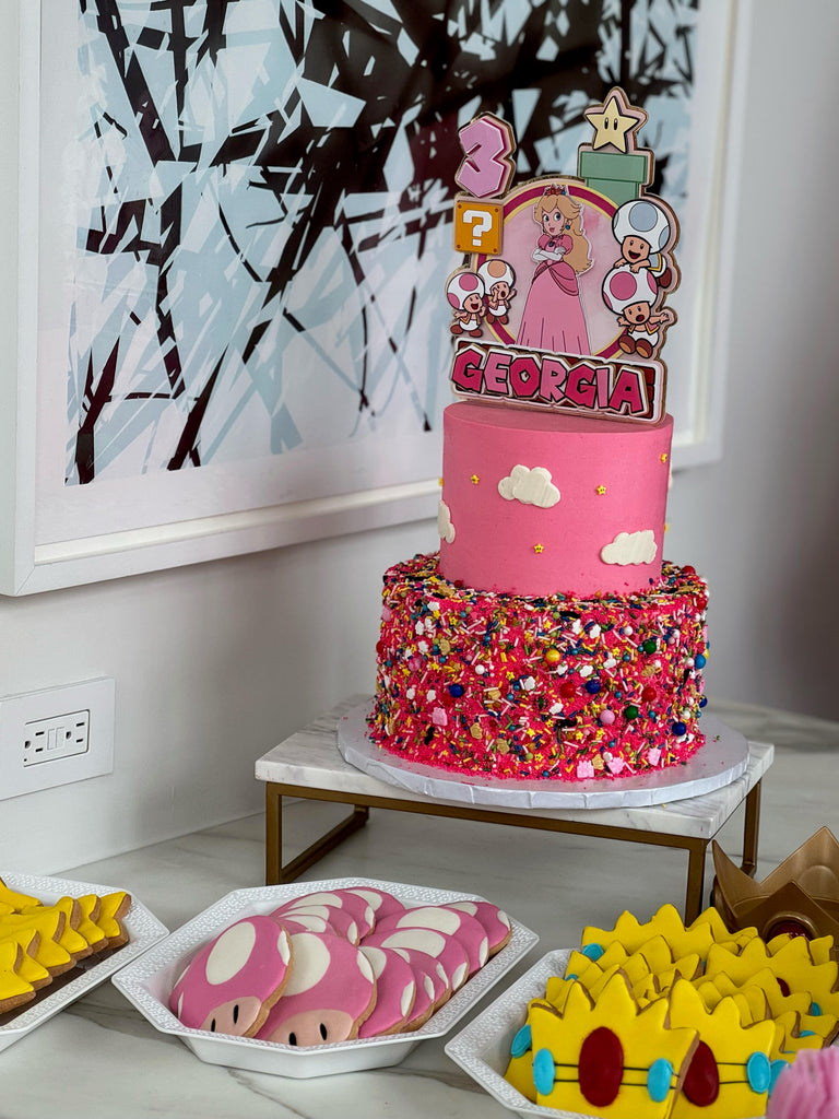 nitendo two teired cake and cookies 