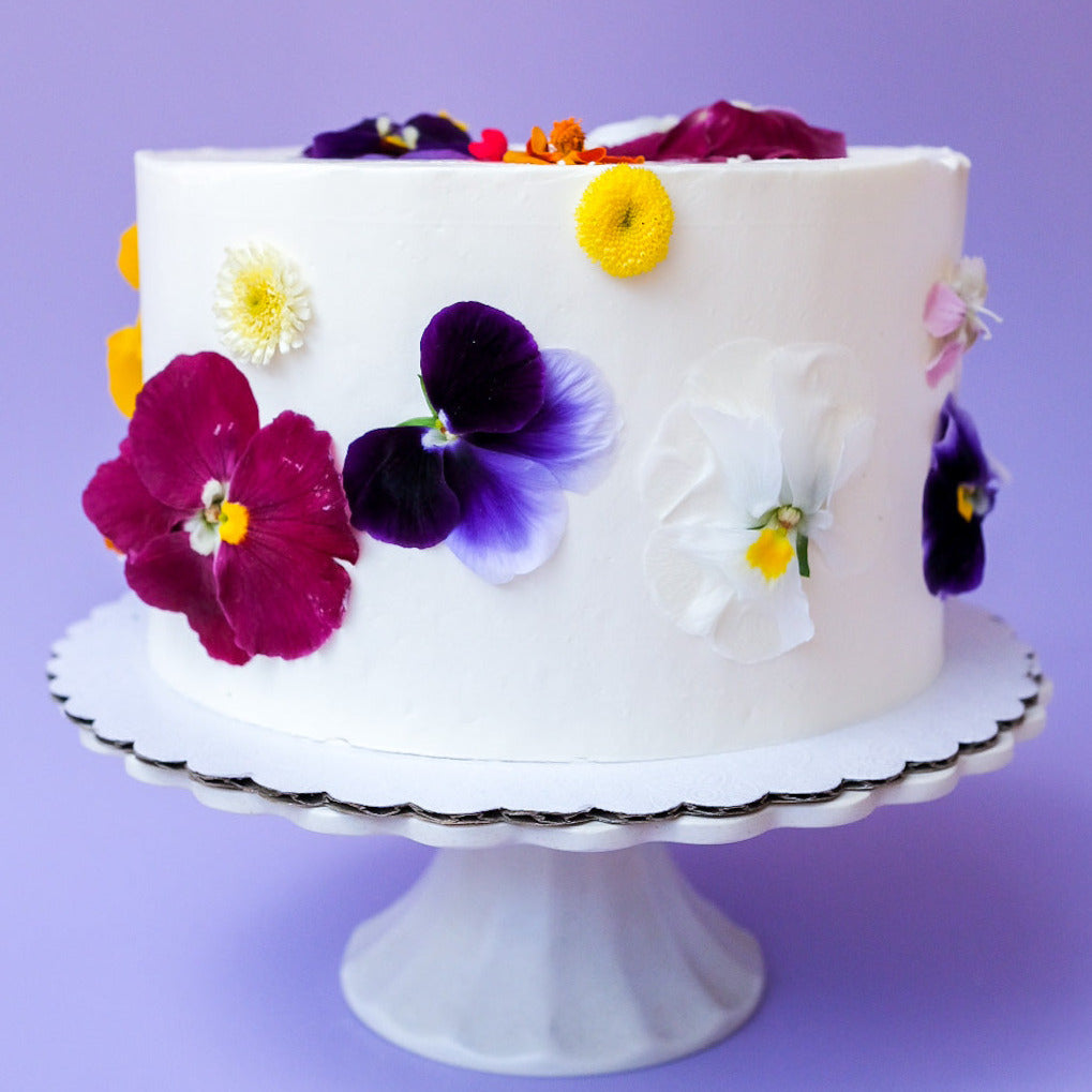 A round edible flower cake 