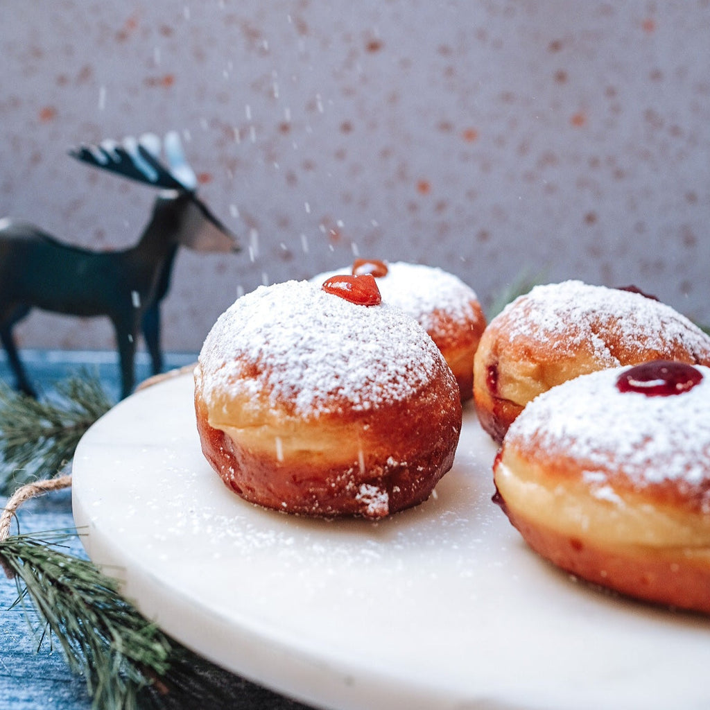 A plate of jelly donuts