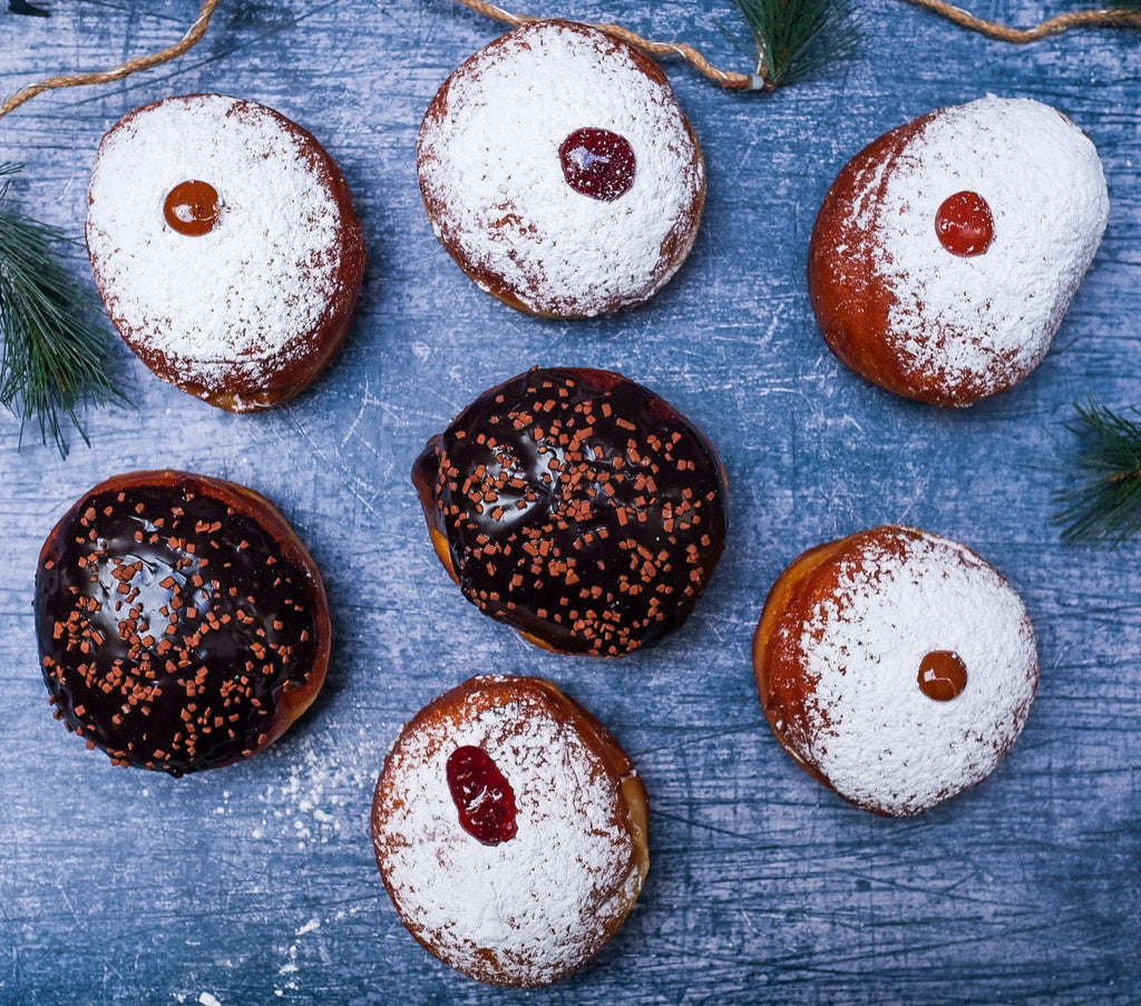 A plate of jelly donuts