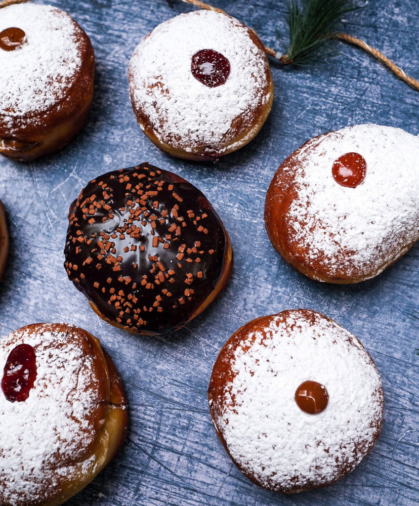 A plate of jelly donuts