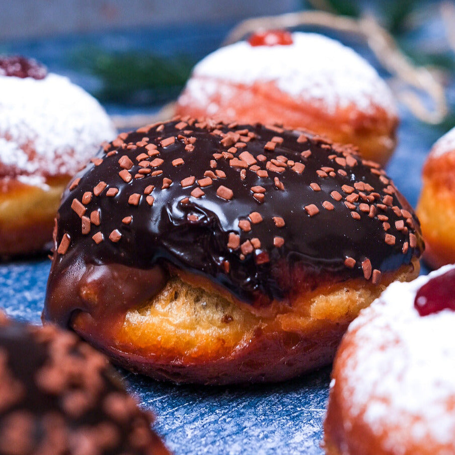 A plate of jelly donuts