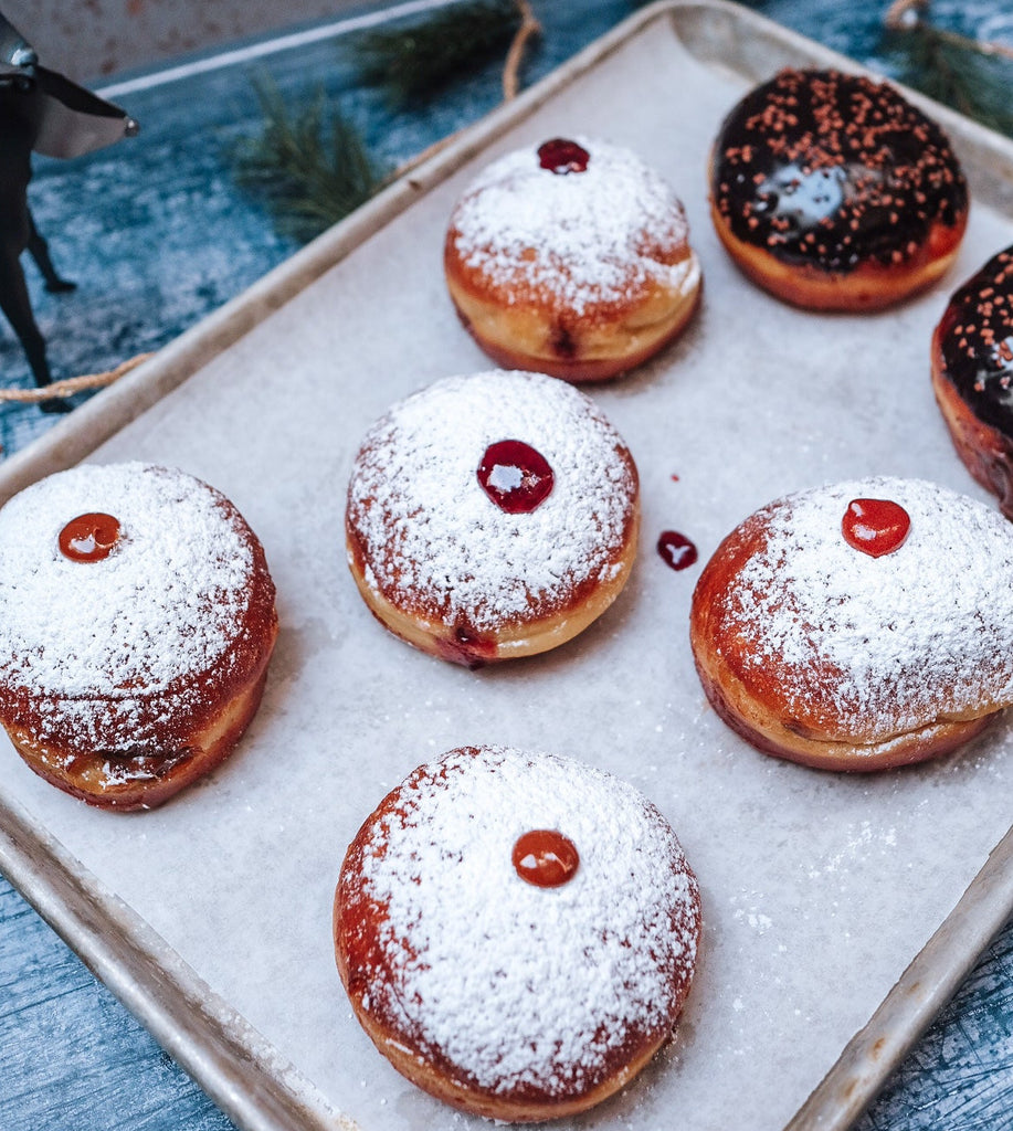 A plate of jelly donuts
