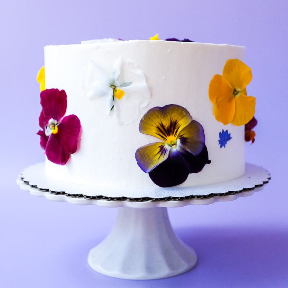 A round edible flower cake 