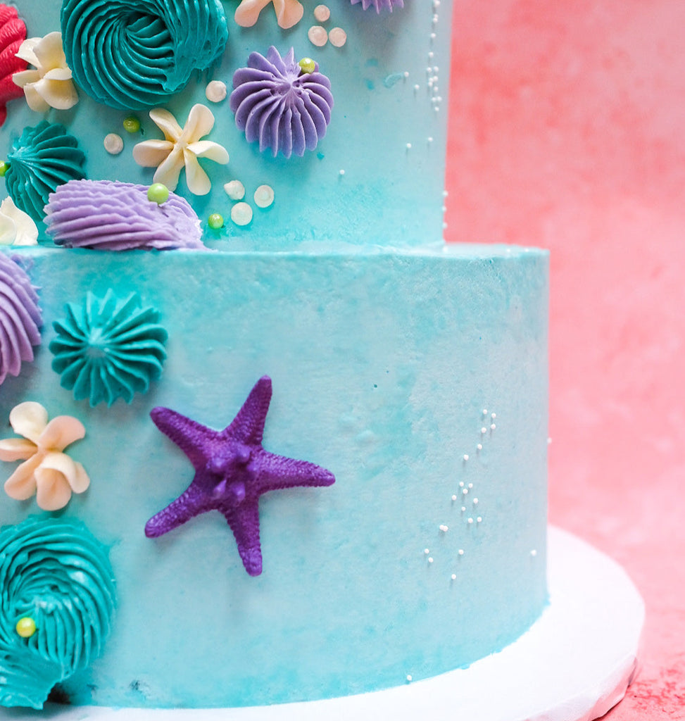A two tiered mermaid cake