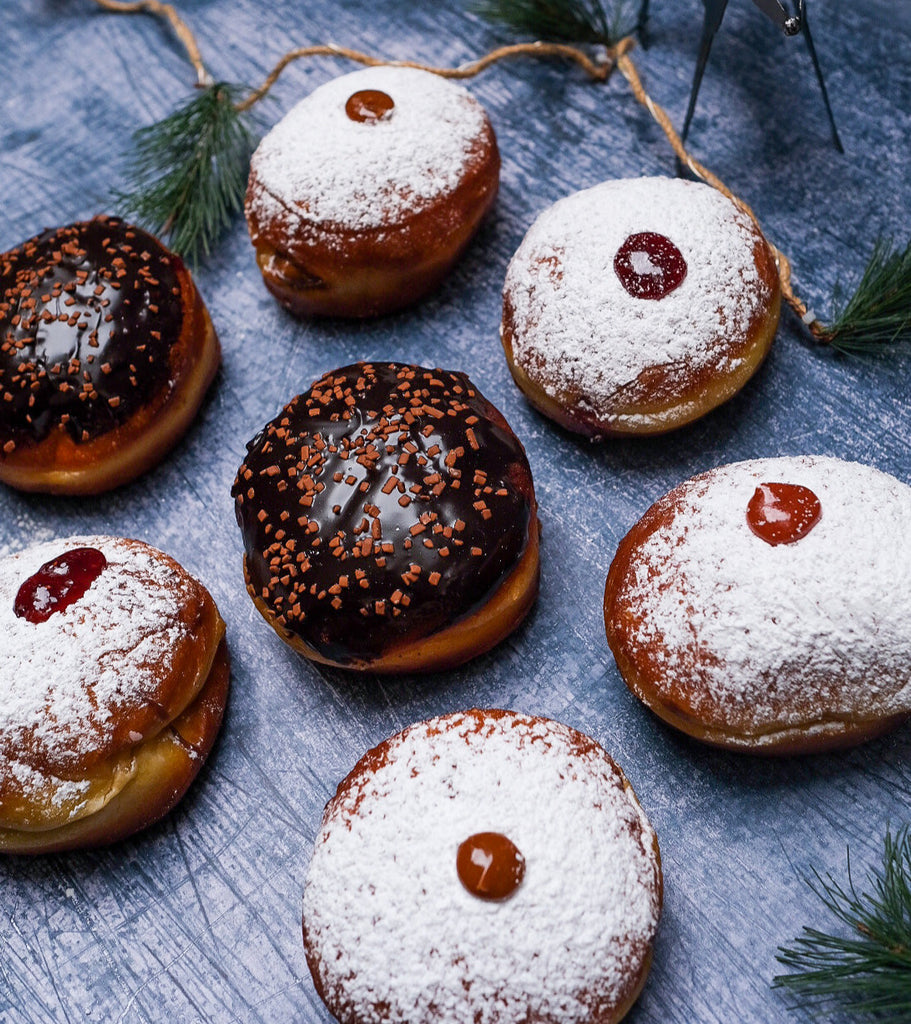 A plate of jelly donuts